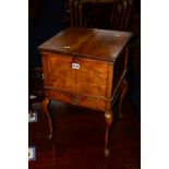 A REPRODUCTION BURR WALNUT DOUBLE HINGED TOPPED SEWING BOX with a single drawer, on cabriole legs