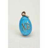 AN ENAMEL EGG PENDANT, decorated in blue guilloche enamel, one side with the initials XB, the