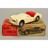 A BOXED VICTORY INDUSTRIES PLASTIC BATTERY OPERATED TRIUMPH TR2 SPORTS CAR, 1/18 scale in ivory with