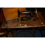 A NEW HOME TREDLE SEWING MACHINE (sd)