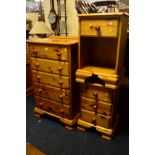 A HONEY PINE CHEST OF FIVE LONG DRAWERS, together with two similar bedside cabinets/drawers