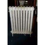 AN EARLY 20TH CENTURY PAINTED CAST IRON FREE STANDING RADIATOR, width 60cm x depth 11cm x height