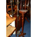 AN OAK CIRCULAR TOPPED TORCHERE STAND together with a pair of stained oak candle stands (sd) (3)