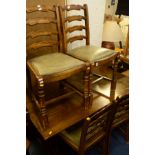 A REPRODUCTION OAK REFECTORY TABLE, width 138cm x depth 77cm x height 74cm and four ladder back