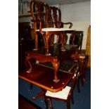 A REPRODUCTION MAHOGANY EXTENDING TWIN PEDESTAL DINING TABLE, with one additional leaf, extended