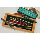 A SELECTION OF PENS, to include mainly Parker ballpoint pens, together with an engine turned 'four