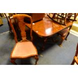 A REPRODUCTION BURR WALNUT TWIN PEDESTAL DINING TABLE, with one additional leaf, extended width