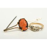 A RING AND A BROOCH, the late Victorian ring set with a central circular quartz flanked by the