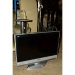 A PANASONIC LCD 32'' TV (REMOTE), together with a Bush DVD player, chrome uplighter standard lamp