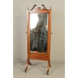 AN EDWARDIAN MAHOGANY AND INLAID CHEVAL MIRROR, the broken swan neck pediment flanked by urn