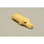 A VICTORIAN IVORY DOG WHISTLE, carved in the form of a hound's head, length 5.8cm (condition: