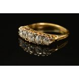 A VICTORIAN DIAMOND HALF HOOP RING, five old European cut diamonds, graduating in size from 3.5mm to