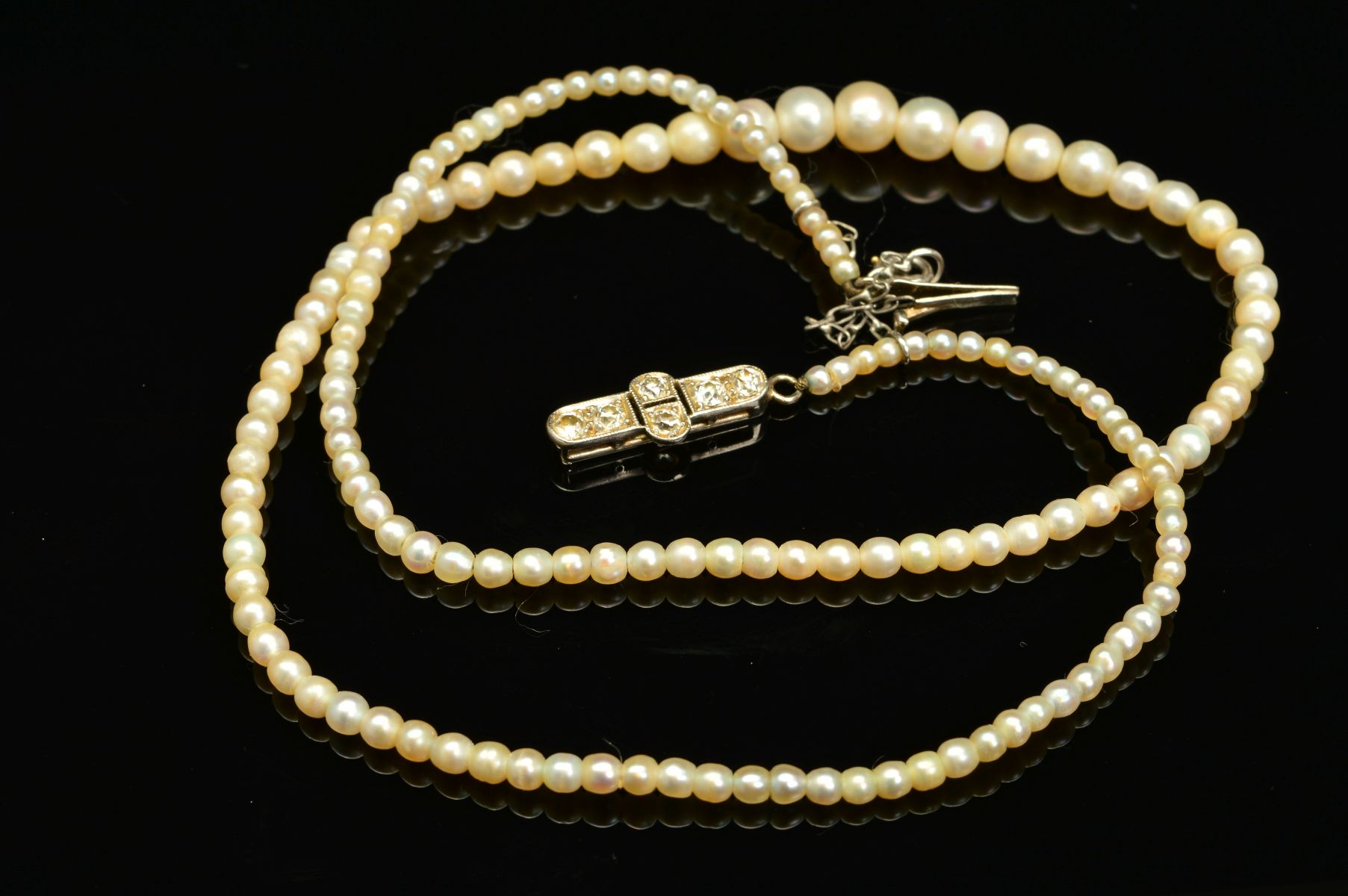 AN EARLY 20TH CENTURY NATURAL SALTWATER PEARL GRADUATED SINGLE ROW PEARL NECKLACE, accompanied by - Image 5 of 7