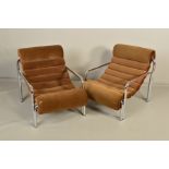 A PAIR OF 1970'S TUBULAR CHROME FRAMED ARMCHAIRS, with brown upholstery (the chairs do not comply