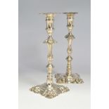 A PAIR OF GEORGE III CAST SILVER CANDLESTICKS BY ROBERT JONES I, LONDON 1781, shaped square