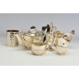 A LATE VICTORIAN SILVER MATCHED BACHELOR'S TEASET, of part reeded oval form, teapot with ebonised