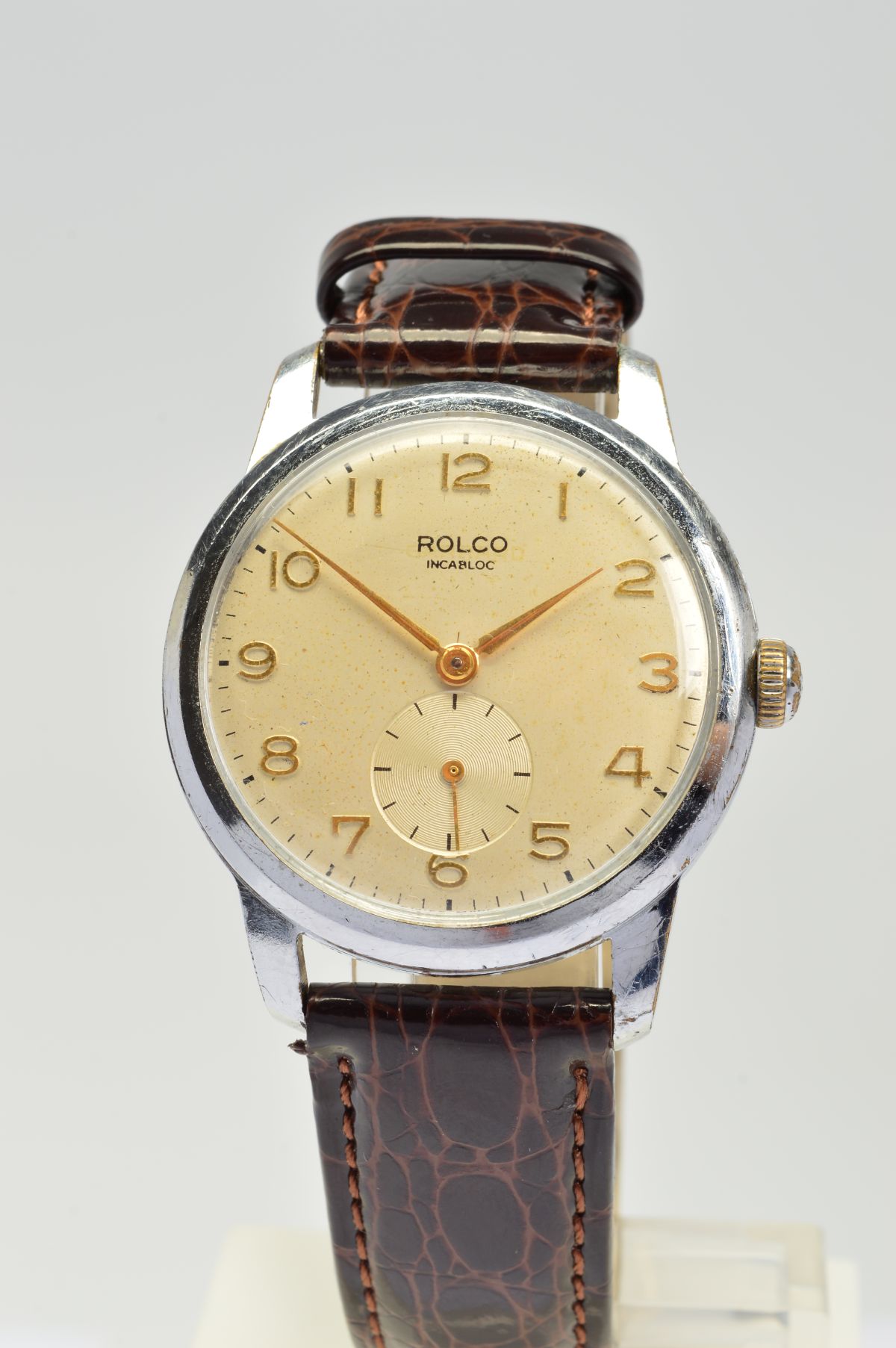 A ROLCO MECHANICAL WRISTWATCH, gold coloured Arabic numerals on a cream dial with subsidiary seconds