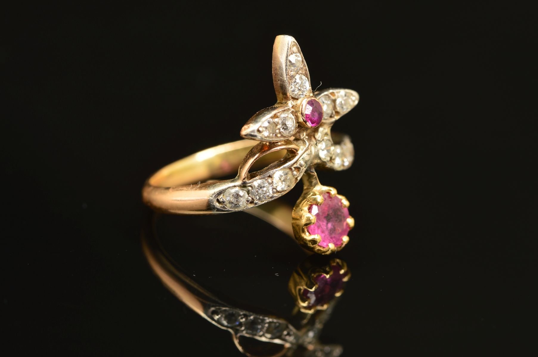 AN EARLY 20TH CENTURY RUBY AND DIAMOND FANCY ABSTRACT RING, a wishbone form supporting foliate - Image 2 of 7