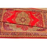 A WOODWARD GROSVENOR & CO LTD WORSTED WOOL WILTON PERSIAN REPRODUCTION CARPET, Tabriz style, red