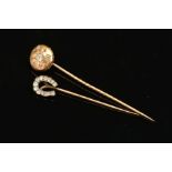 TWO VICTORIAN GOLD AND DIAMOND STICKPINS, the first with a round domed disc, centring on an old