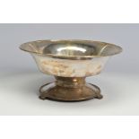 A GEORGE V SILVER CIRCULAR PEDESTAL BOWL WITH HAND HAMMERED FINISH, the stepped interior with raised