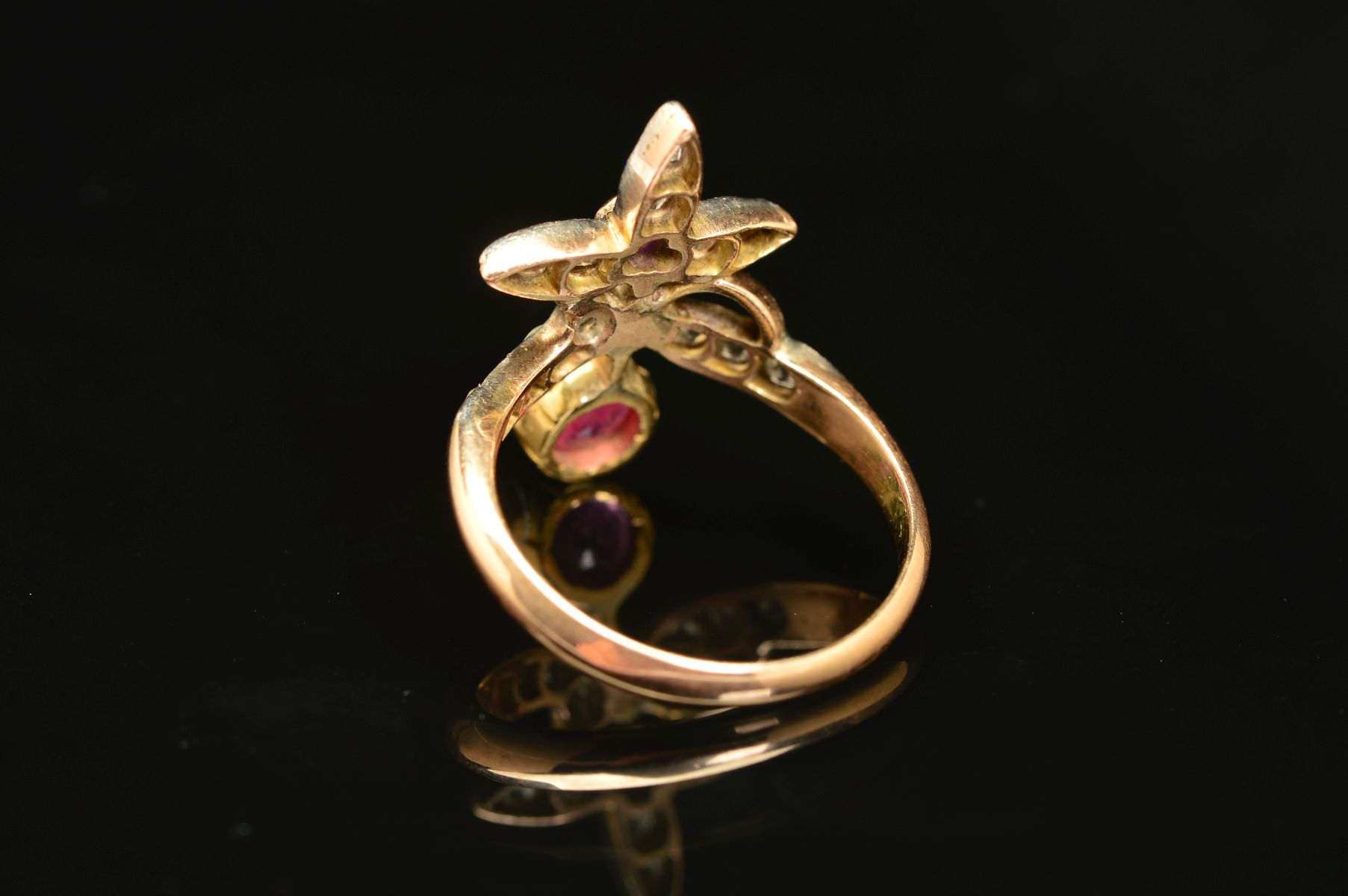 AN EARLY 20TH CENTURY RUBY AND DIAMOND FANCY ABSTRACT RING, a wishbone form supporting foliate - Image 7 of 7