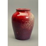 A HIGH FIRED RUSKIN POTTERY FLAMBE VASE, the red glaze over a white ground with copper green