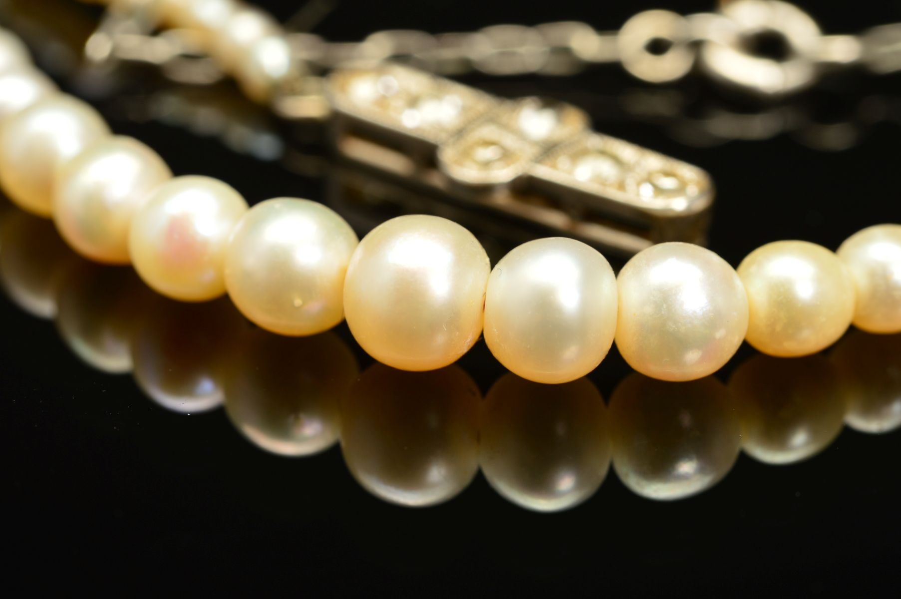 AN EARLY 20TH CENTURY NATURAL SALTWATER PEARL GRADUATED SINGLE ROW PEARL NECKLACE, accompanied by - Image 3 of 7