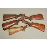 FIVE GUN STOCKS, comprising of a Winchester semi-auto shotgun stock, two Winchester 23 stocks, a