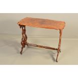 A VICTORIAN WALNUT AND ROSEWOOD SIDE TABLE, of wavy rectangular form, on gothic style moulded and