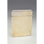 AN EDWARDIAN SILVER CARD CASE, of rectangular form, plain exterior with hinged top, maker George