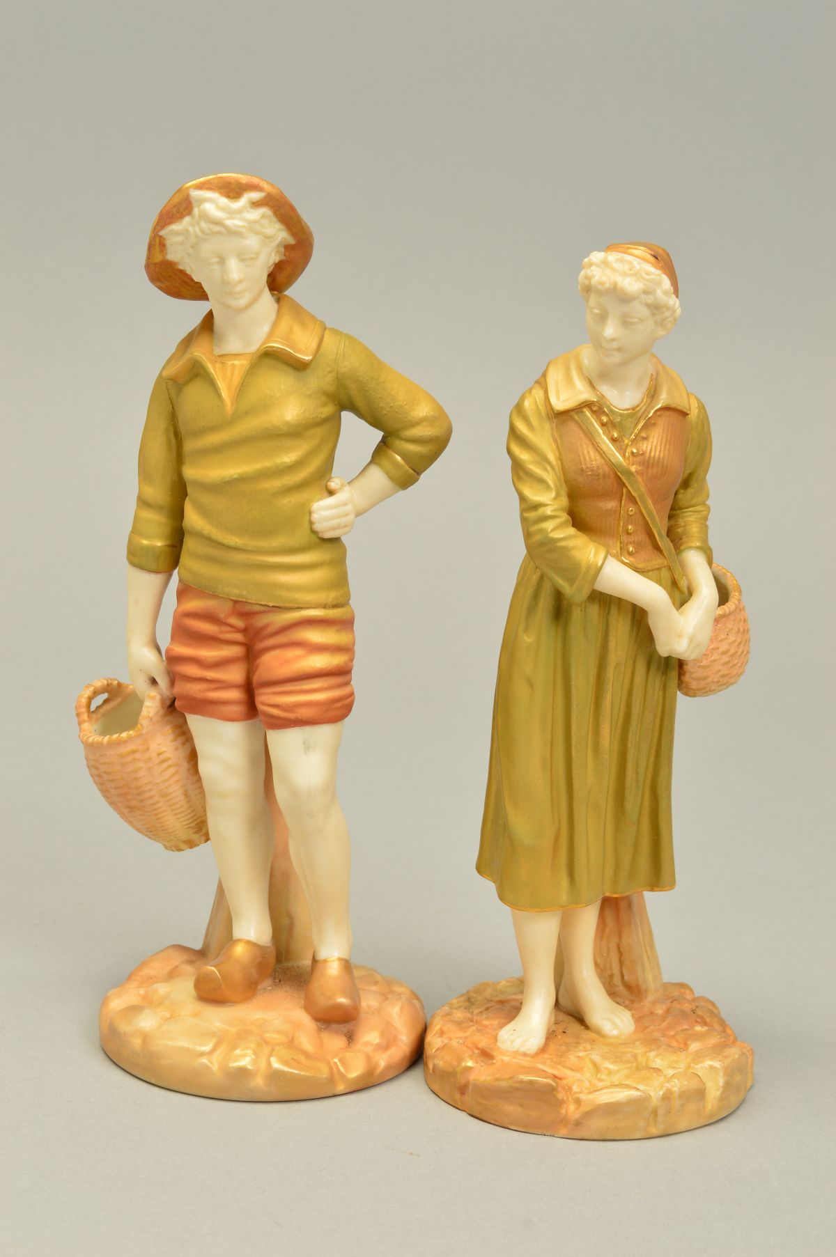 A PAIR OF ROYAL WORCESTER FIGURES OF FRENCH FISHERMAN AND WOMAN, model No.1202 to both, ivory skin