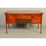 AN EARLY 19TH CENTURY MAHOGANY AND INLAID BOW FRONT SIDEBOARD, fitted with a single drawer above a