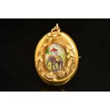 A VICTORIAN GOLD BROOCH PENDANT, centring on a plaque of an elephant and howdah to a gold foliate