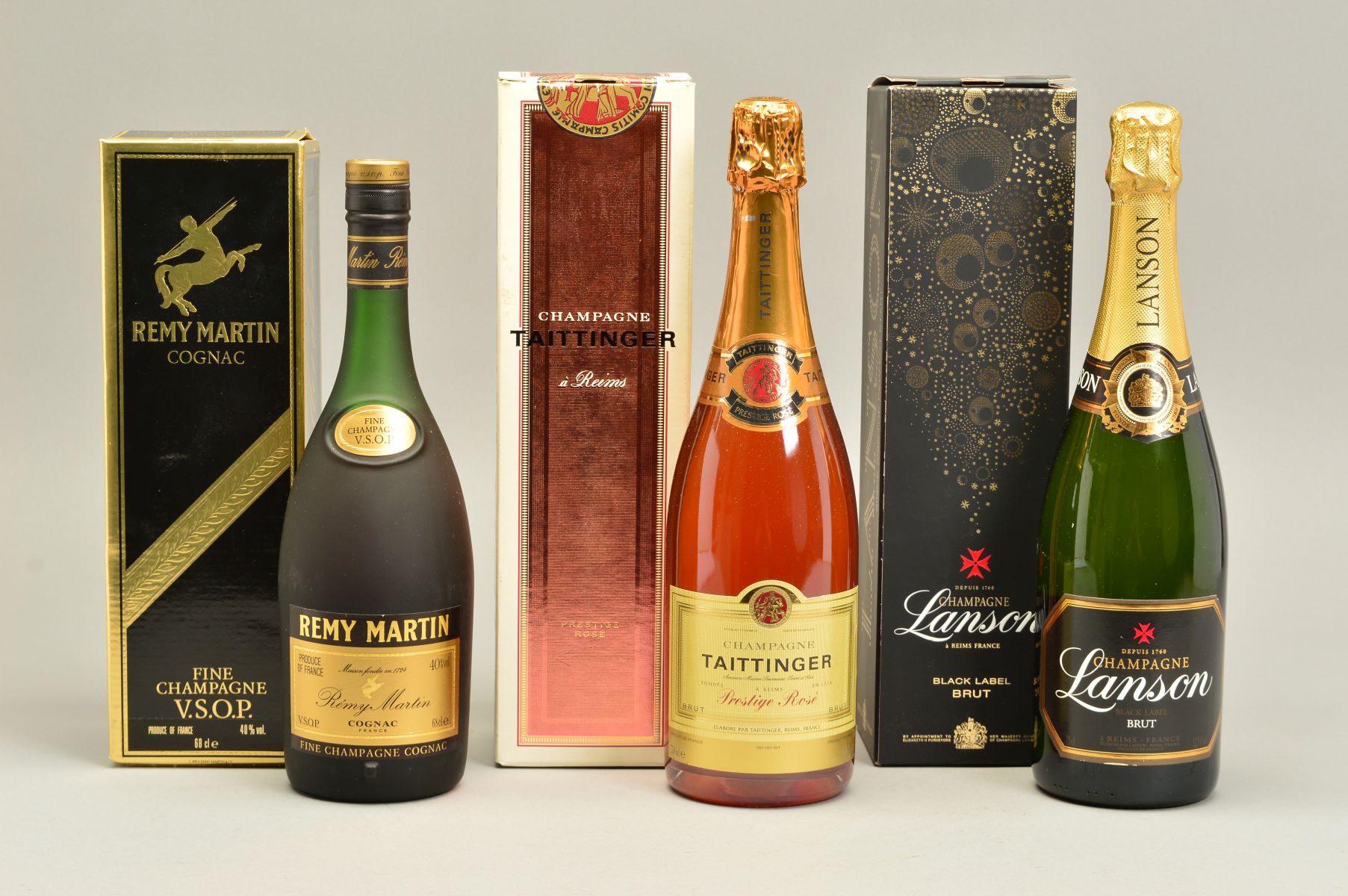 TWO BOTTLES OF CHAMPAGNE AND A BOTTLE OF FINE CHAMPAGNE COGNAC, comprising a bottle of Tattinger