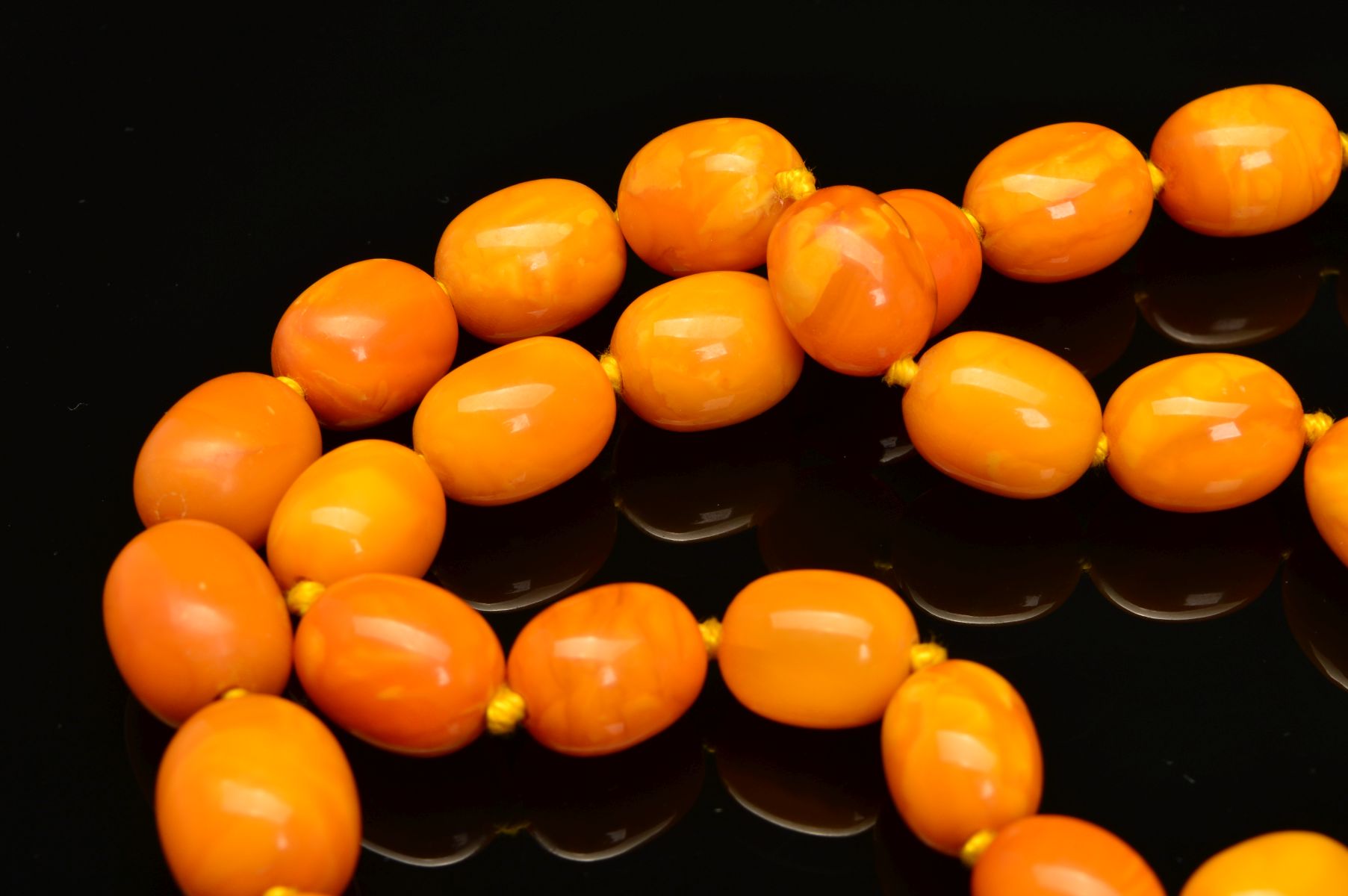 A LONG NATURAL AMBER BEAD NECKLACE, designed as sixty one graduated barrel shape butterscotch - Image 3 of 5