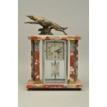 A FRENCH ART DECO MARBLE MANTEL CLOCK, surmounted by a spelter dog on a grey and orange veined