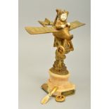 AN EARLY 20TH CENTURY FRENCH GILT BRONZE AND CARVED IVORY FIGURE OF A BOY IN AN AIRPLANE, AFTER