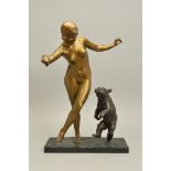 A LATE 20TH CENTURY BRONZE OF A NUDE FEMALE DANCER WITH A BEAR CUB, after Jean Verscheider, on a