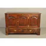 A GEORGE III OAK LANCASHIRE CHEST, hinged plank top over a central cupboard door opening to reveal