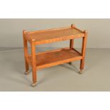 ROBERT THOMPSON OF KILBURN MOUSEMAN OAK RECTANGULAR TWO TIER TEA TROLLEY, on block legs and orbit