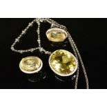 A MODERN 18CT WHITE GOLD, CITRINE AND DIAMOND PENDANT AND EARRING SET, the pendant comprised a large