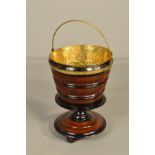 A LATE VICTORIAN PEDESTAL JARDINIERE/COAL BUCKET, with brass liner with an ebonised and walnut