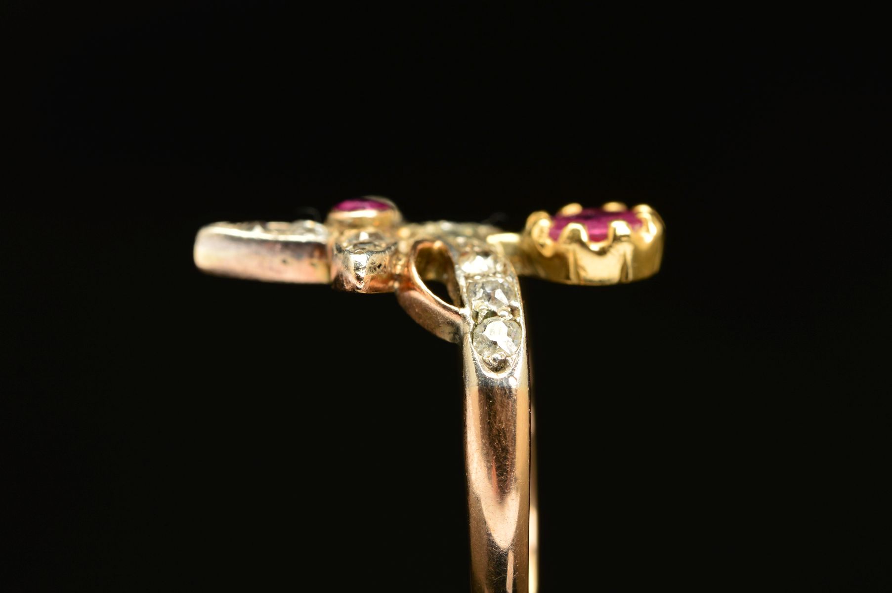 AN EARLY 20TH CENTURY RUBY AND DIAMOND FANCY ABSTRACT RING, a wishbone form supporting foliate - Image 6 of 7