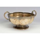 A GEORGE IV SILVER TWIN HANDLED BOWL, of wavy circular form, the 'S' scroll handles with acanthus