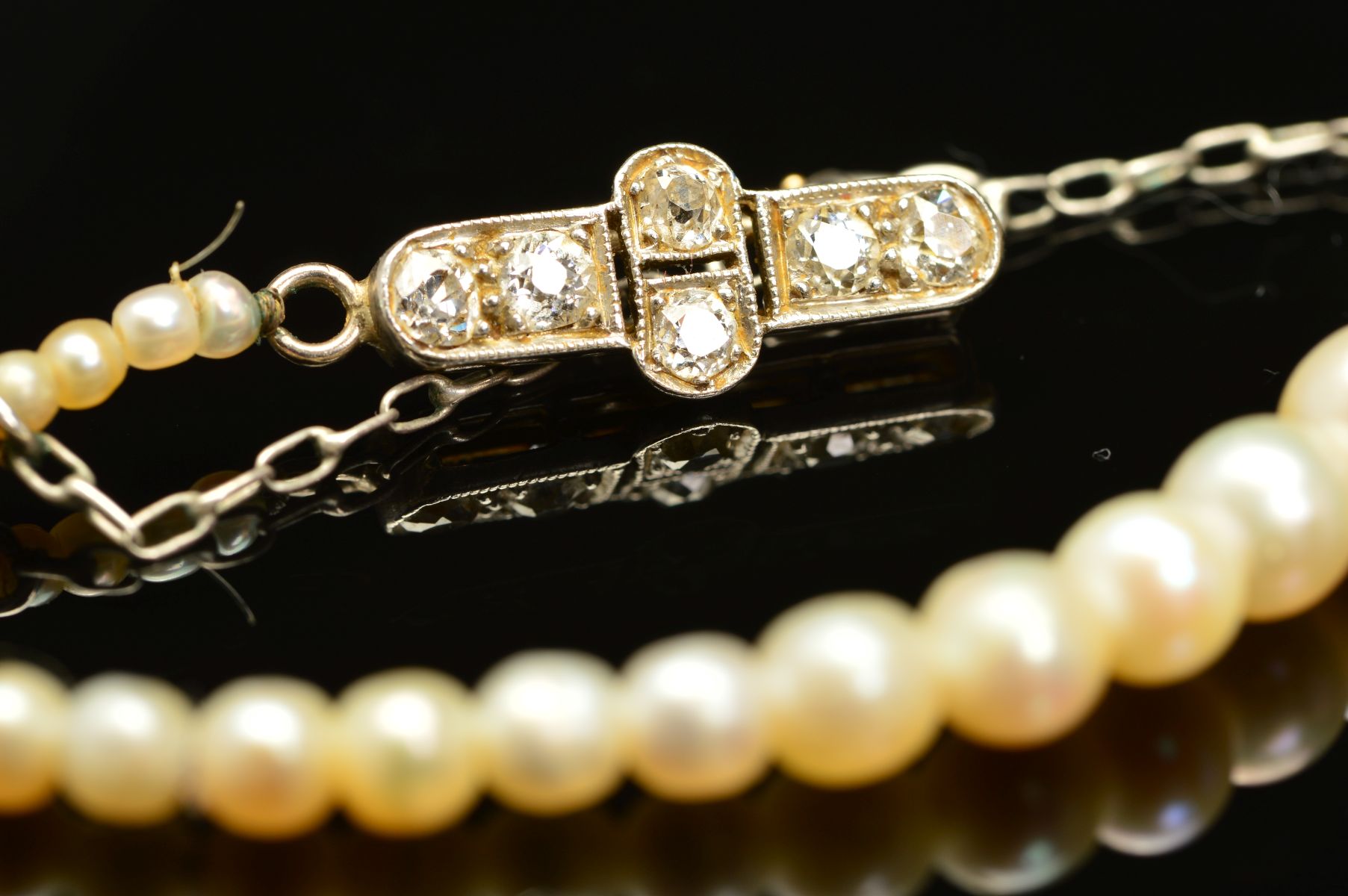 AN EARLY 20TH CENTURY NATURAL SALTWATER PEARL GRADUATED SINGLE ROW PEARL NECKLACE, accompanied by - Image 2 of 7