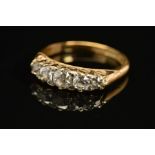 A LATE VICTORIAN TO EARLY 20TH CENTURY DIAMOND HALF HOOP RING, comprised five old European cut