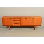 GREAVES AND THOMAS, a 1970's teak and afromosia sideboard, with three central graduating drawers,
