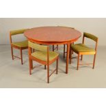 MCINTOSH AND CO, a teak circular extending dining table, one additional fold out leaf, extended