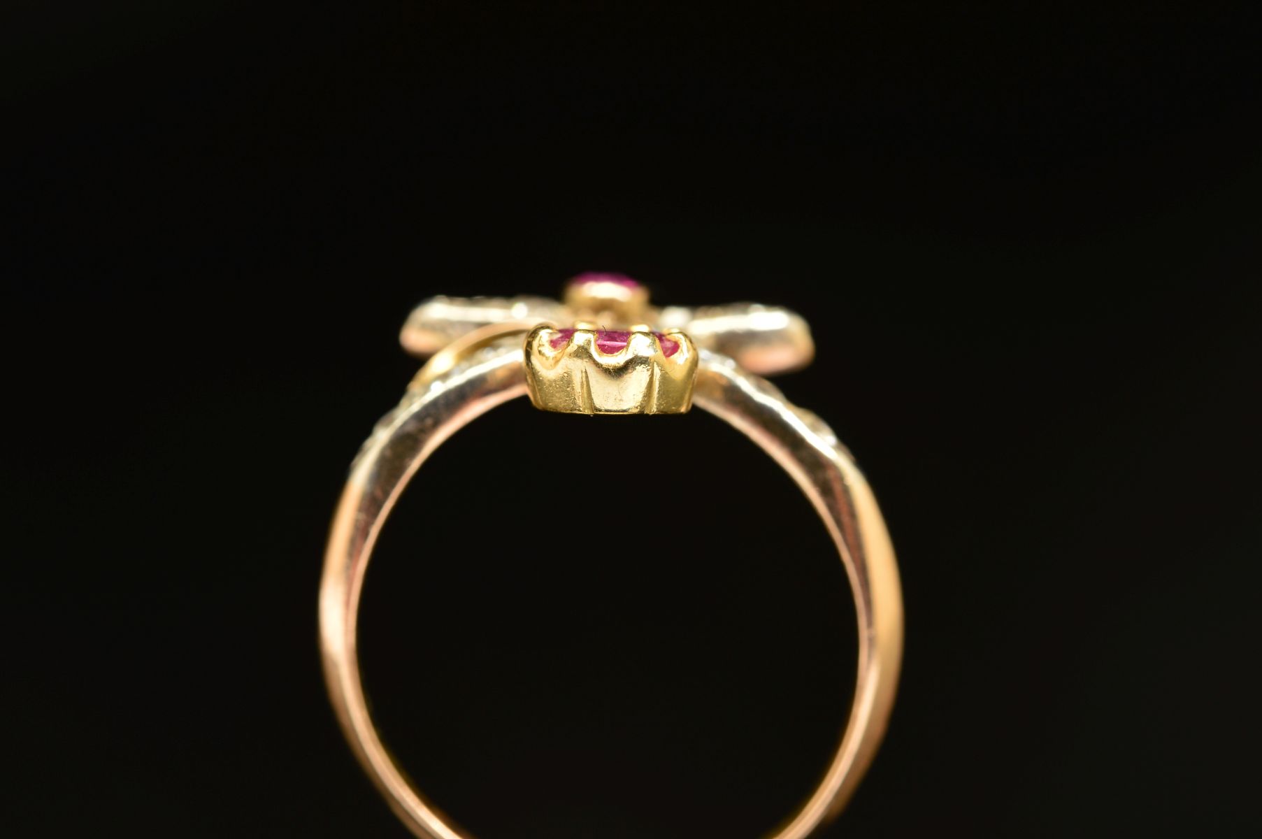 AN EARLY 20TH CENTURY RUBY AND DIAMOND FANCY ABSTRACT RING, a wishbone form supporting foliate - Image 5 of 7